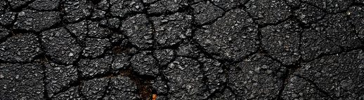 cracked asphalt road surface