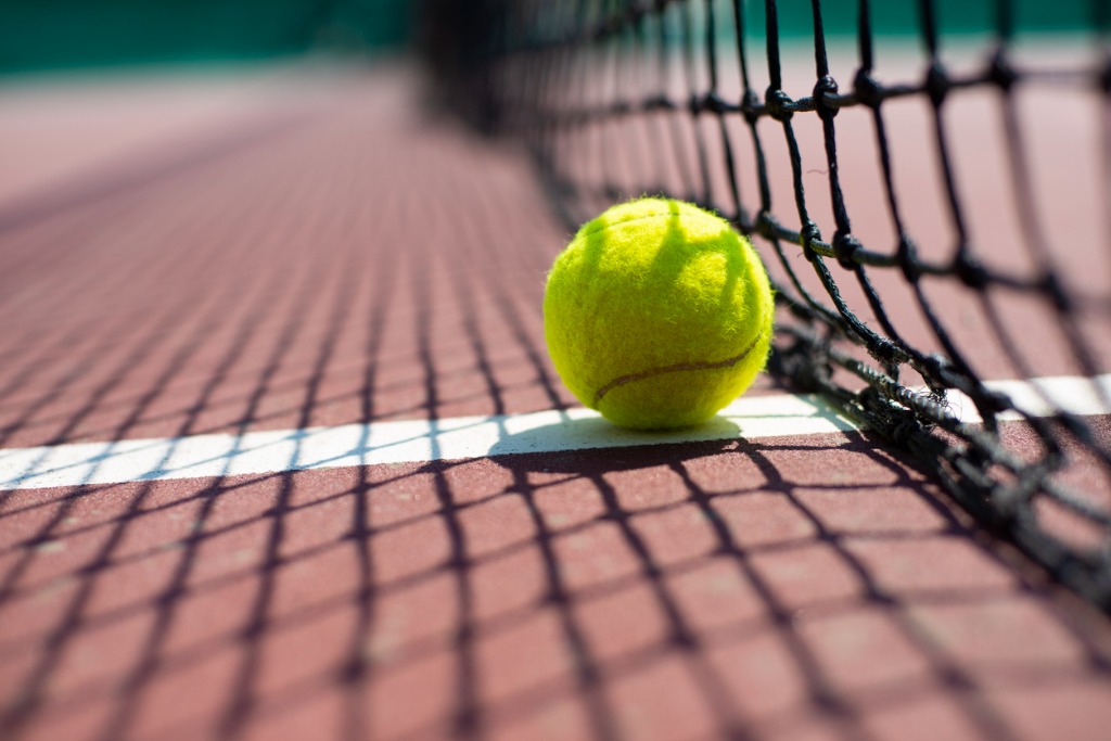 tennis-ball-lying-on-tennis-court