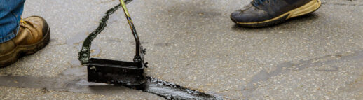 Asphalt-road-with-filled-cracks-repair-liquid-of-the-fix-road
